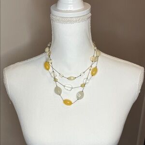 Elegant Multi-Strand Necklace with Yellow and Cream Accents